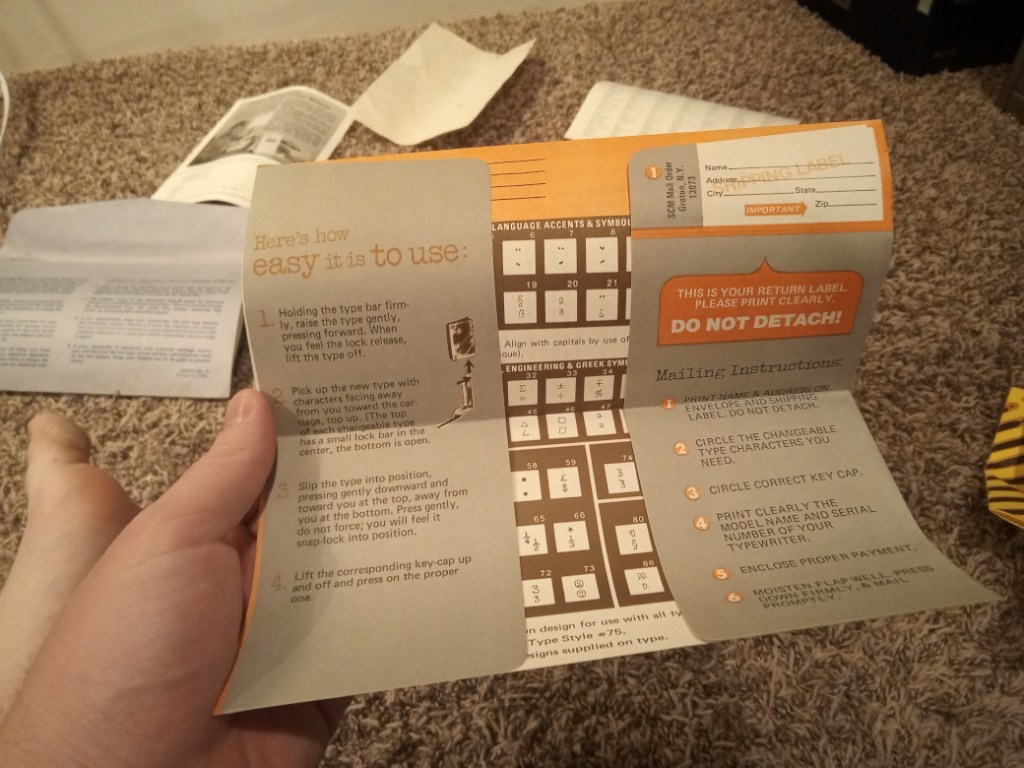 Me holding the typeset-order envelope